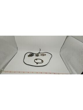 Mixed Metal Jewelry Set with Skull Ring, Feather Pendant, and Beaded Bracelet